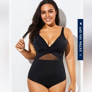 Black one piece swimsuit, size XL. Never been worn. Tags intact.